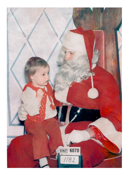 This is a restored family photo featuring santa meeting a baby relative of mine.